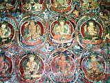 Tibet Guge 03 Tholing 04 Red Temple Many Images Along the left hand wall are floor-to-ceiling rows of deities entwined in wreath-like borders each interleaving into a whole organic complex across the entire space. Photo - Th�ni: Westtibet.